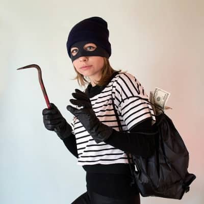  Young woman dressed as a catburglar.
