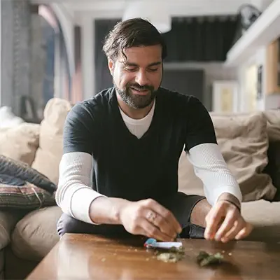 A person rolling a joint.